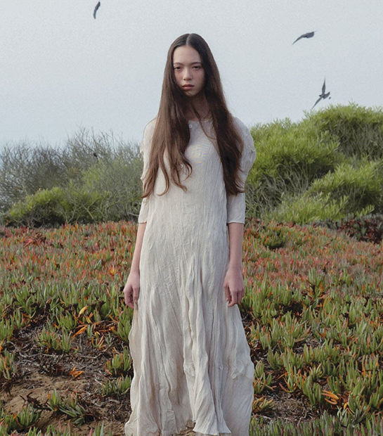 Woman in white dress in nature
